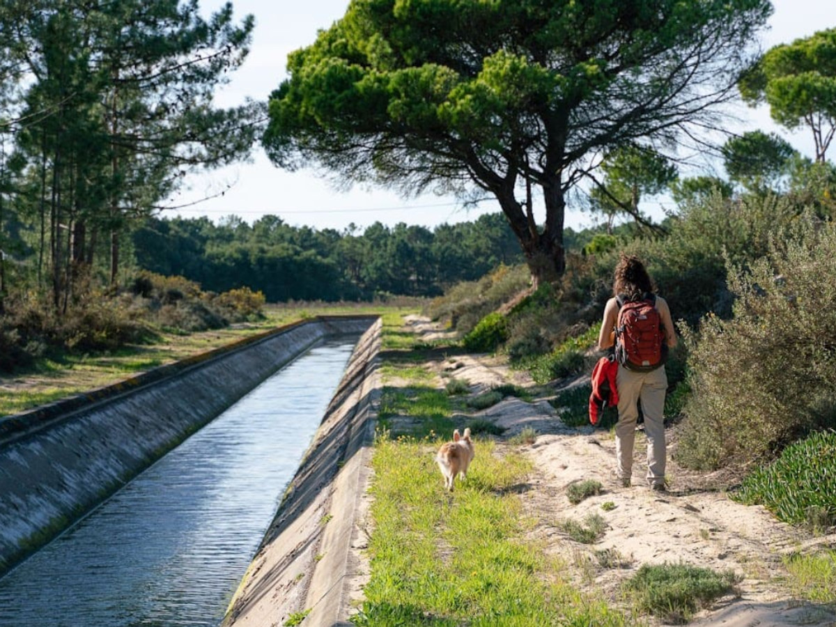 Hiking a trail along a water channel in Comporta